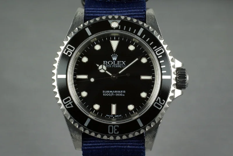 Rolex Watches: The Ultimate Luxury Experience –2004 Rolex Submariner 14060 with Box and Papers