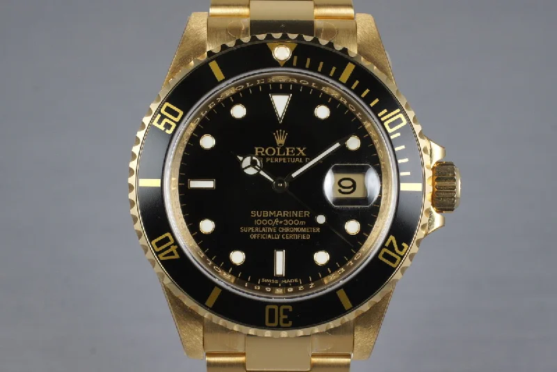 Discover Limited Edition Rolex Watches –2006 Rolex YG Submariner 16618 with Box and Papers MINT with stickers